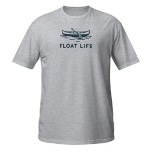 May include: A gray t-shirt with a navy blue canoe and paddle graphic and the text "FLOAT LIFE" printed on the front.