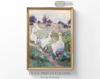 May include: A framed print depicting a rural landscape with white geese. The artwork, titled "Geese Parade" by Olive Prints Gallery, is in a gold frame and has a soft, impressionistic style with muted colours.