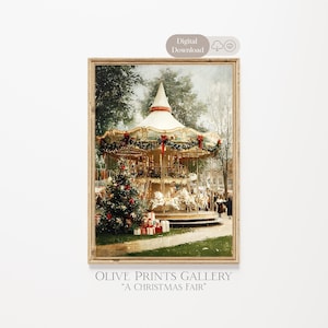 May include: A framed print depicting a vintage carousel scene. The carousel is adorned with lights and garlands, with a Christmas tree and wrapped gifts in the foreground. The text "OLIVE PRINTS GALLERY" and "A CHRISTMAS FAIR" are at the bottom.