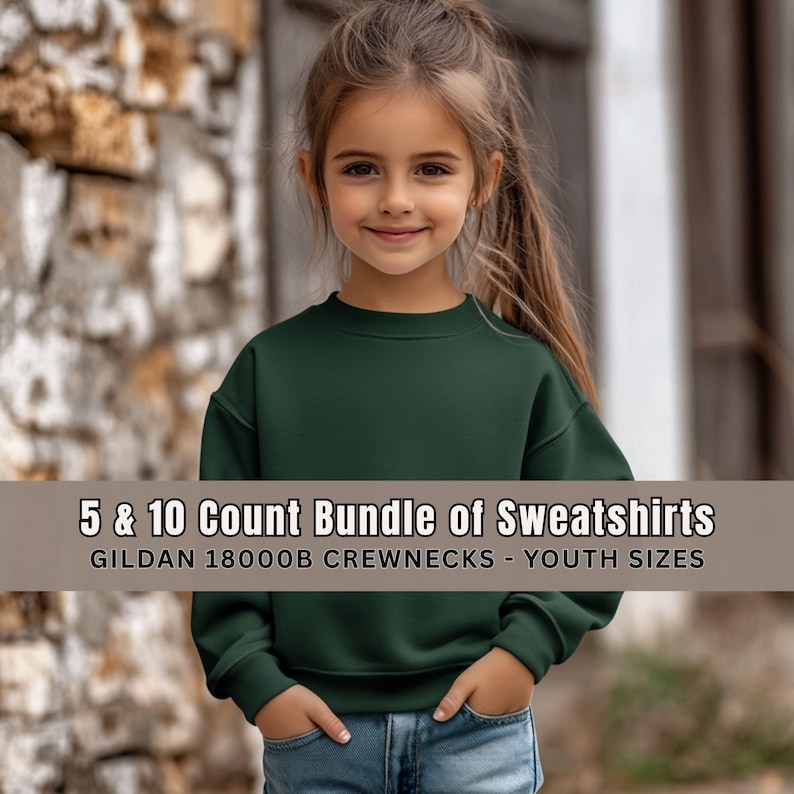 May include: A young person wearing a dark green crewneck sweatshirt and blue jeans. The sweatshirt has a round neckline and long sleeves. Text on the image reads: "5 & 10 Count Bundle of Sweatshirts" and "GILDAN 18000B CREWNECKS - YOUTH SIZES."