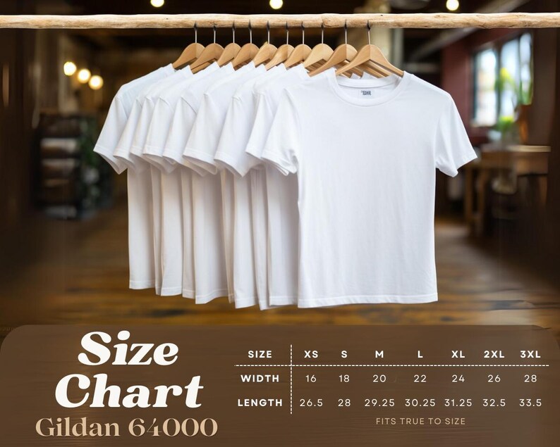 May include: Several white Gildan 64000 t-shirts hanging on wooden hangers. A size chart is displayed below, showing measurements in inches for width and length, ranging from XS to 3XL. The shirts are displayed against a blurred background.