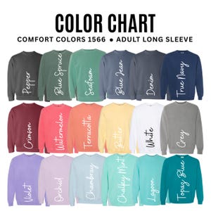 May include: Color chart of Comfort Colors 1566 adult long sleeve sweatshirts in various colors, including Pepper, Blue Spruce, Seafoam, Blue Jean, Denim, True Navy, Crimson, Watermelon, Terracotta, Butter, White, Grey, Violet, Orchid, Chambray, Chalky Mint, Lagoon, and Topaz Blue.
