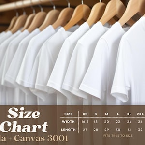 May include: A row of white t-shirts hanging on wooden hangers. The image includes a size chart for Bella + Canvas 3001 shirts, detailing width and length measurements from XS to 3XL. The text "FITS TRUE TO SIZE" is also visible.