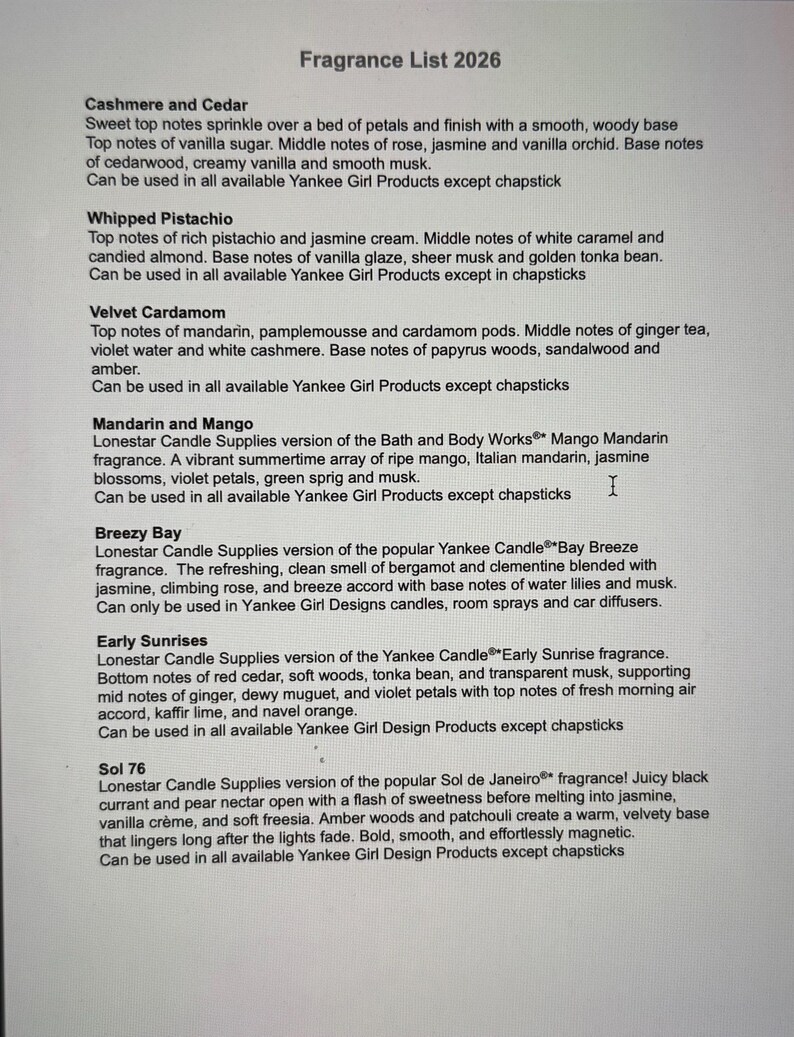 May include: A printed list titled "Fragrance List 2026" detailing scent descriptions for various Yankee Girl Products. Scents include Cashmere and Cedar, Whipped Pistachio, Velvet Cardamom, Mandarin and Mango, Breezy Bay, Early Sunrises, and Sol 76.