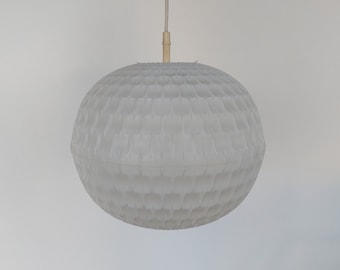 May include: A white, round, textured pendant light fixture with a white cord.