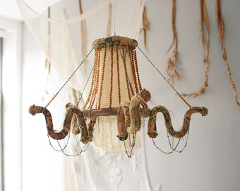 Antique style chandelier, handmade natural materials, vintage Victorian fabrics, tassel beaded textiles, poetic decorative candlestick