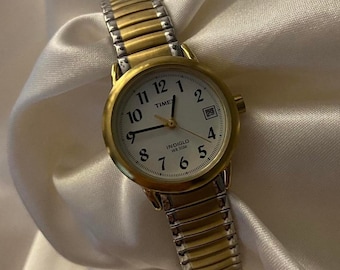 Belle montre délicate avec horloge analogique dorée/argentée