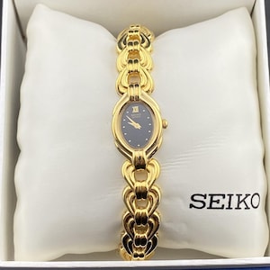 NOS Vinatage Seiko Black Oval Dial Gold Tone Dainty Art Deco Ladies Watch NIB