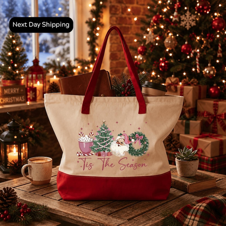 A festive Christmas scene with a red and white tote bag featuring a Christmas tree and other holiday decorations, placed on a wooden table.