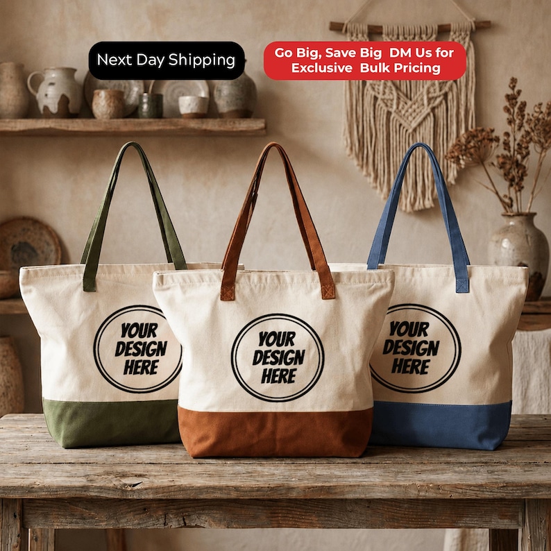 Three tote bags with the text "YOUR DESIGN HERE" printed on them, placed on a wooden table.