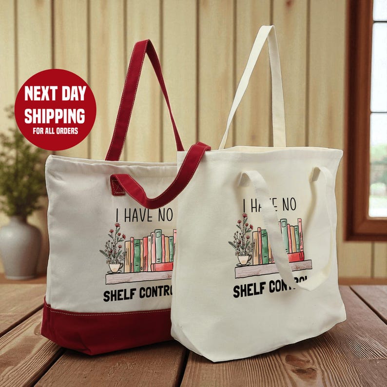 Two tote bags with the text "I HAVE NO SHELF CONTROL" printed on them, placed on a wooden surface.