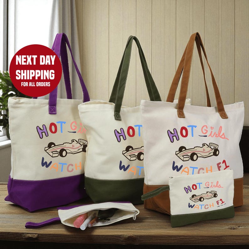a collection of colorful tote bags and a small bag, all featuring the same design and text.