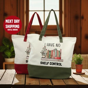 two tote bags with a humorous text printed on them, placed on a wooden surface.