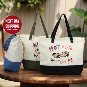 two tote bags with printed designs, placed on a wooden table.