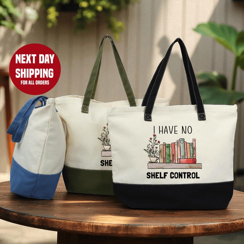 two tote bags with printed designs, one white and one green, placed on a wooden table.
