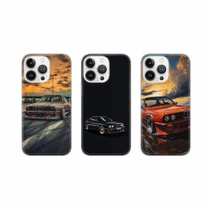 May include: Three iPhone cases with different designs featuring a black and a red car. The first case has a black car on a black background. The second case has a red car on a sunset background. The third case has a red car on a black background.