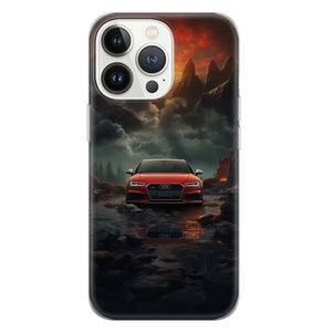 May include: A red Audi car driving through a dark, misty landscape with mountains in the background. The car is reflected in a puddle of water.