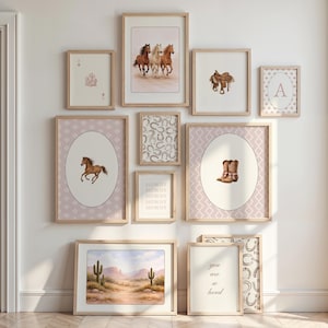 May include: A collection of framed art prints with a Western theme. The prints feature images of horses, cowboy boots, a saddle, horseshoes, and desert landscapes. The color palette includes shades of brown, pink, and beige. Some prints have the word "Howdy" and "you are so loved".