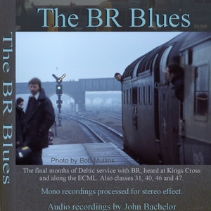 May include: A vintage record album cover featuring a black and white photo of a train with the text "The BR Blues" in blue and white lettering. The album cover also includes the text "Photo by Bob Mullins", "The final months of Deltic service with BR, heard at Kings Cross and along the ECML. Also classes 31, 40, 46 and 47.", "Mono recordings processed for stereo effect." and "Audio recordings by John Bachelor".