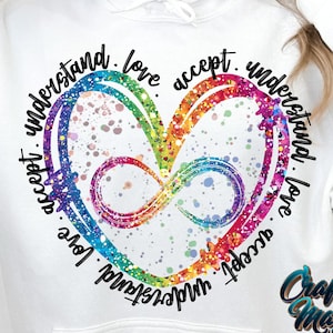 May include: White hoodie with a rainbow heart and the text "understand. love. accept. understand. love. accept." around it.