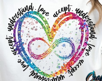 Puede incluir: Sudadera blanca con un corazón arcoíris y el texto "understand. love. accept. understand. love. accept." alrededor.