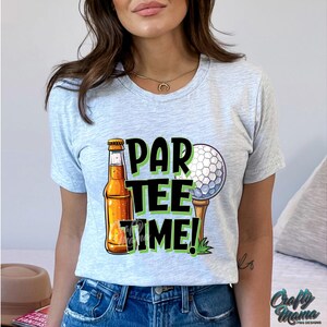 May include: A grey t-shirt with a graphic design of a beer bottle, a golf ball, and the text "Par Tee Time!"