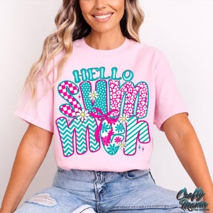 May include: Pink t-shirt with a colorful graphic that says "Hello Summer" in a retro style. The graphic features a mix of patterns, including stripes, polka dots, and animal print.