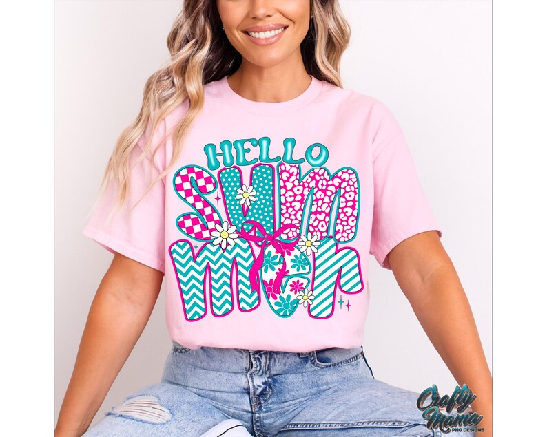 May include: Pink t-shirt with a colorful graphic that says "Hello Summer" in a retro style. The graphic features a mix of patterns, including stripes, polka dots, and animal print.