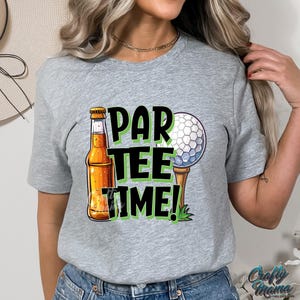 May include: Grey t-shirt with a graphic of a beer bottle, golf ball, and the text "Par Tee Time!"