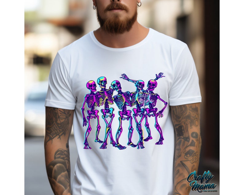 May include: White t-shirt with a graphic of five skeletons in a line, dancing. The skeletons are outlined in black and filled with a gradient of pink, blue, and purple.