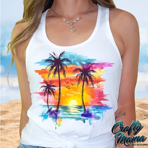 May include: White tank top with a colorful watercolor sunset design featuring palm trees and a beach scene.