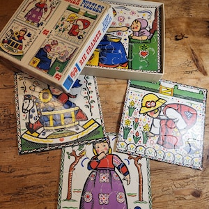 Vintage cardboard puzzle with 4,6,9 and 16 pieces. Rie Cramer, kiddy puzzles. Old Dutch, clogs, costumes, rocking horse, tulips