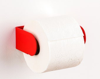 Porte-papier hygiénique moderne - Rouge Peleton. Accrochez-la avec une bande VHB 3M ou des vis colorées (toutes deux incluses). Design hollandais