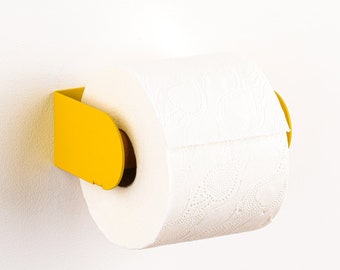 Moderne toiletpapierhouder - Peleton geel. Ophangen met 3M VHB strip of gekleurde schroeven (beide meegeleverd). Nederlands Ontwerp