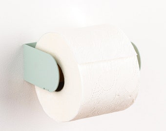 Porte-papier hygiénique moderne - Peleton vert sauge. Accrochez-la avec une bande VHB 3M ou des vis colorées (toutes deux incluses). Design hollandais