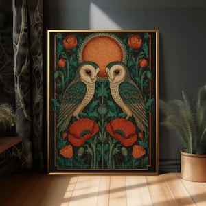 May include: A rectangular framed wall art print featuring two barn owls facing each other, centered beneath a large orange circular sun. The owls are surrounded by dark green foliage and vibrant red poppy flowers, all enclosed within a thin gold frame.