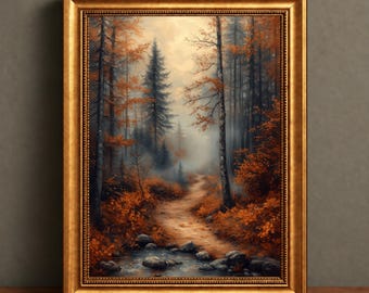 Puede incluir: Una lámina de arte enmarcada que representa un sendero forestal en otoño. La escena muestra árboles altos con follaje naranja y marrón, un camino de tierra sinuoso y un pequeño arroyo rocoso en primer plano, dentro de un marco dorado.