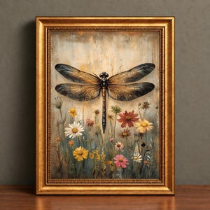 May include: A framed wall art piece featuring a large, detailed dragonfly with translucent, veined wings centered above a field of colorful wildflowers including white daisies, red coneflowers, and yellow blossoms on a textured, neutral background.