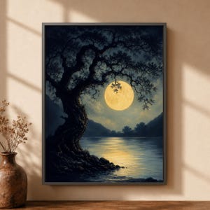 May include: A framed wall art print depicting a dark, silhouetted tree standing on a rocky shoreline at night. A large, luminous yellow full moon hangs in the sky, casting a golden reflection across the calm water surface below the dark mountains.