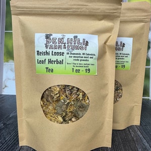 May include: A brown paper bag with a clear window showing a blend of dried herbs and flowers. The bag is labelled "Den Hill Farm & Fungi Reishi Loose Leaf Herbal Tea 1 oz - £9".