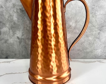 Copper coffee pot, hammered and made in the USA.