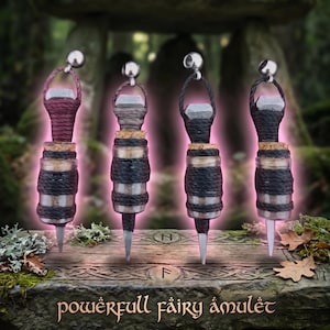 May include: Four fairy amulets with glass vials wrapped in black and gray twine, topped with a silver bell and a cork. The text "powerful fairy amulet" is below the amulets. The background is a forest setting.