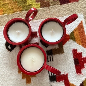 Three red metal tealight holders. Swedish vintage 1980s.