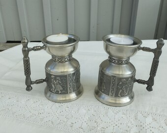 Two decorative pewter T-light holders with a handle.  Swedish art 1970s.