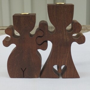 Two fanny handmade brow wooden candle holders. Swedish vintage 1980s.