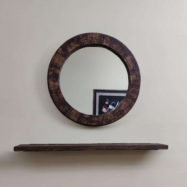 Step into your rustic oasis with our Herringbone Rustic Wood Framed Mirror, a statement piece that adds warmth and charm to any room. Crafted with care, this mirror exudes a perfect blend of modern and vintage aesthetics.