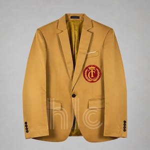 May include: Mustard yellow blazer with a classic notched lapel, a single-button closure, and a small pocket on the chest. The blazer features a red and gold embroidered crest on the left chest and four buttons on each cuff. The interior lining is a golden yellow.