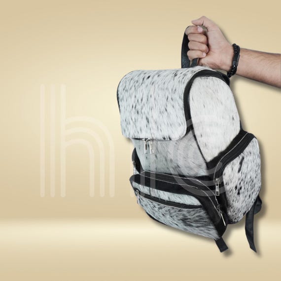 cowskin leather backpack Real Cowhide Bag - Cowhide Travel Bag this backpack combines rugged style with everyday function Handmade Black Cowhide Leather Backpack,