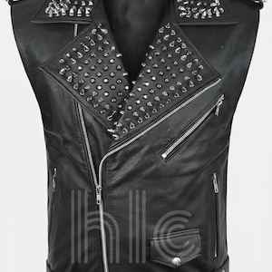 May include: Black leather vest with silver metal cone studs on the collar and shoulders. The vest has a zippered front, multiple pockets, and a belt with a buckle at the waist. A stylish, edgy fashion item.