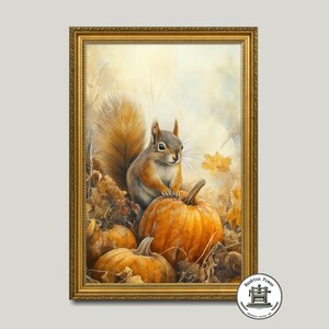 May include: A framed painting of a squirrel sitting on a pumpkin with two other pumpkins in the background. The squirrel is brown and gray with a bushy tail. The pumpkins are orange and the background is a soft yellow with brown leaves.